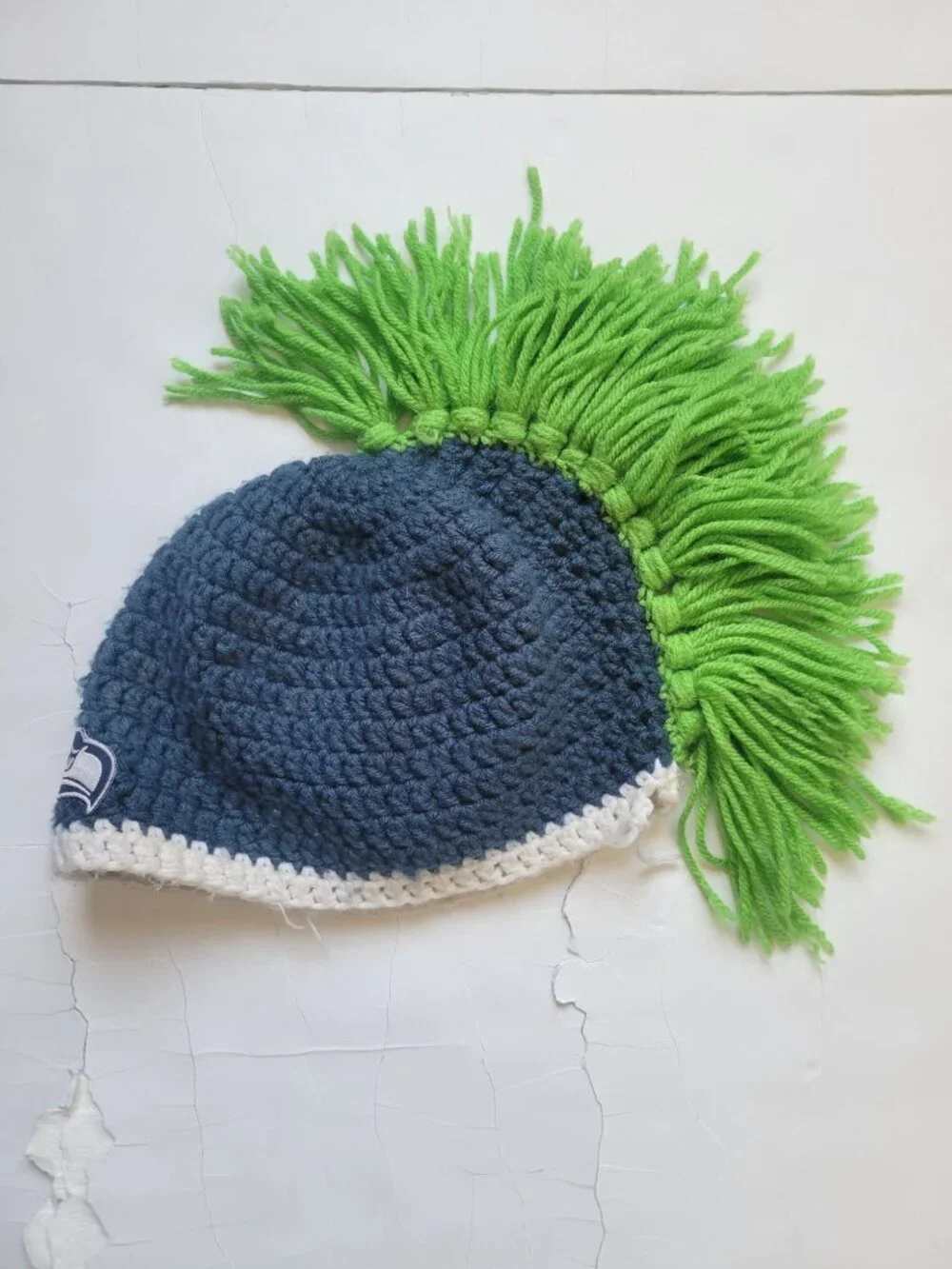 hand-crocheted Seattle Seahawks beanie blue yarn, a white brim, bright green Hat
